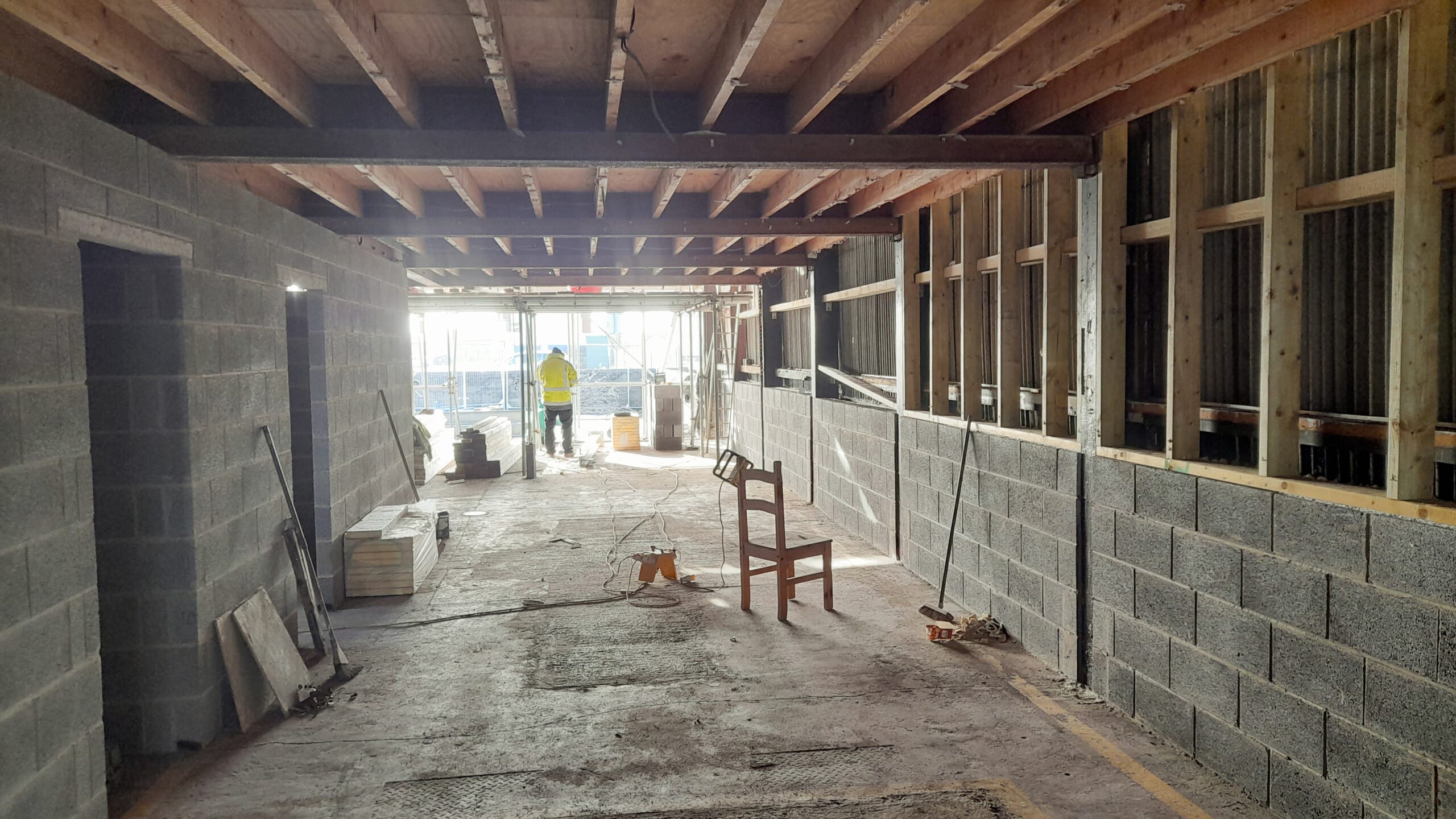 Construction phase of the Musclemorph Private Gym retrofit in Pwllheli, showing the former garage interior being refurbished